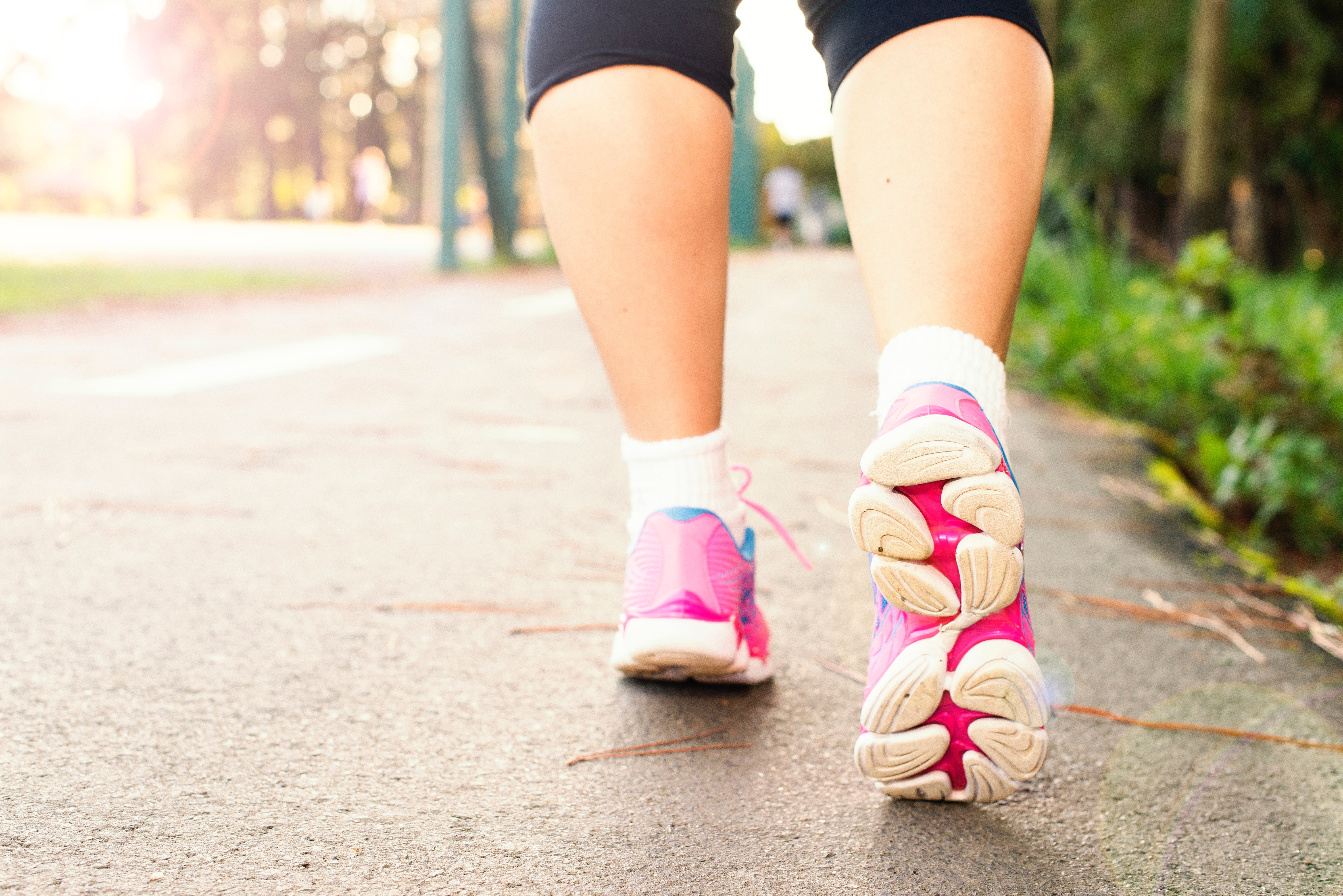 Woman walking with trainers on