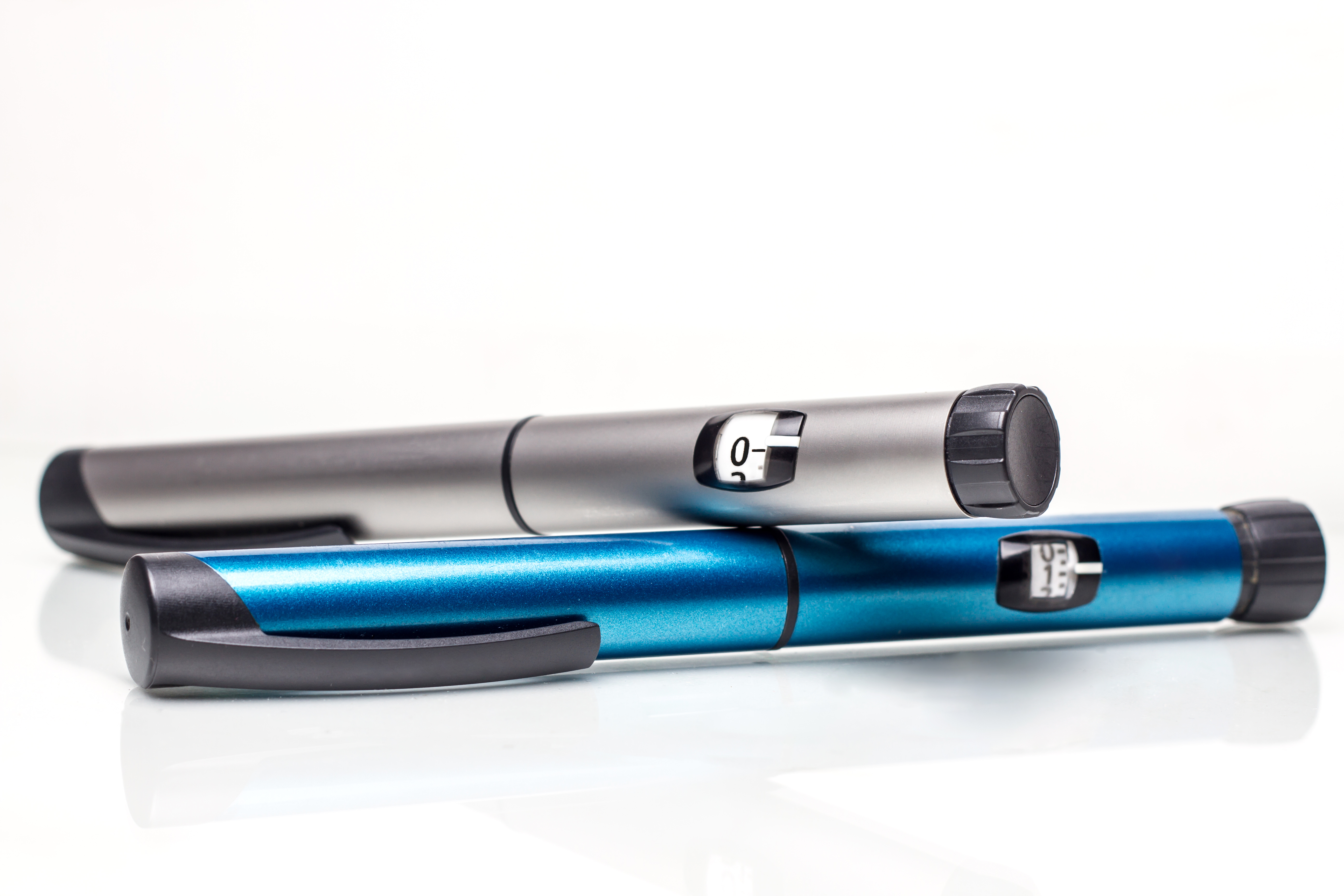 Two insulin silver and blue pens