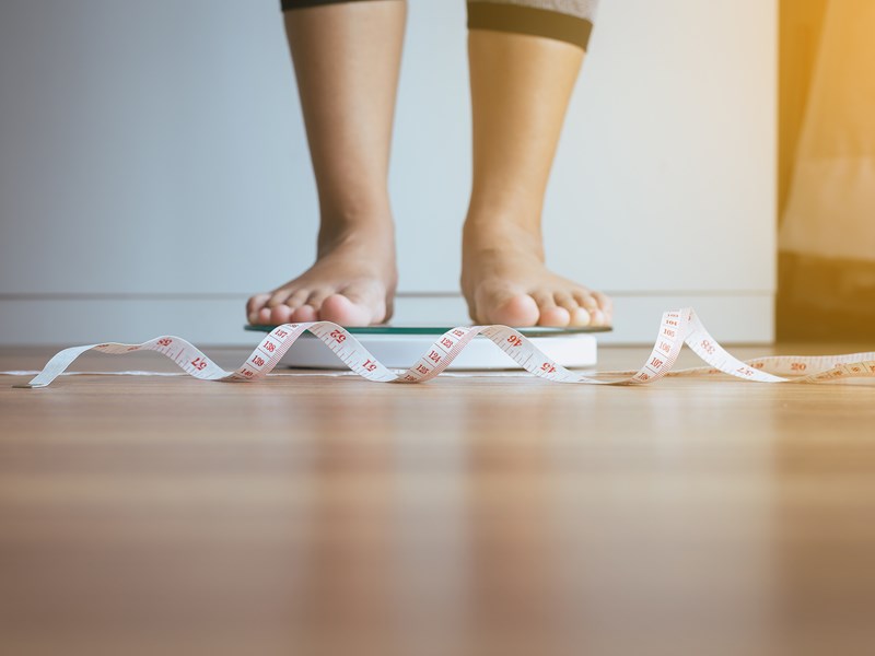 Someone standing on scales