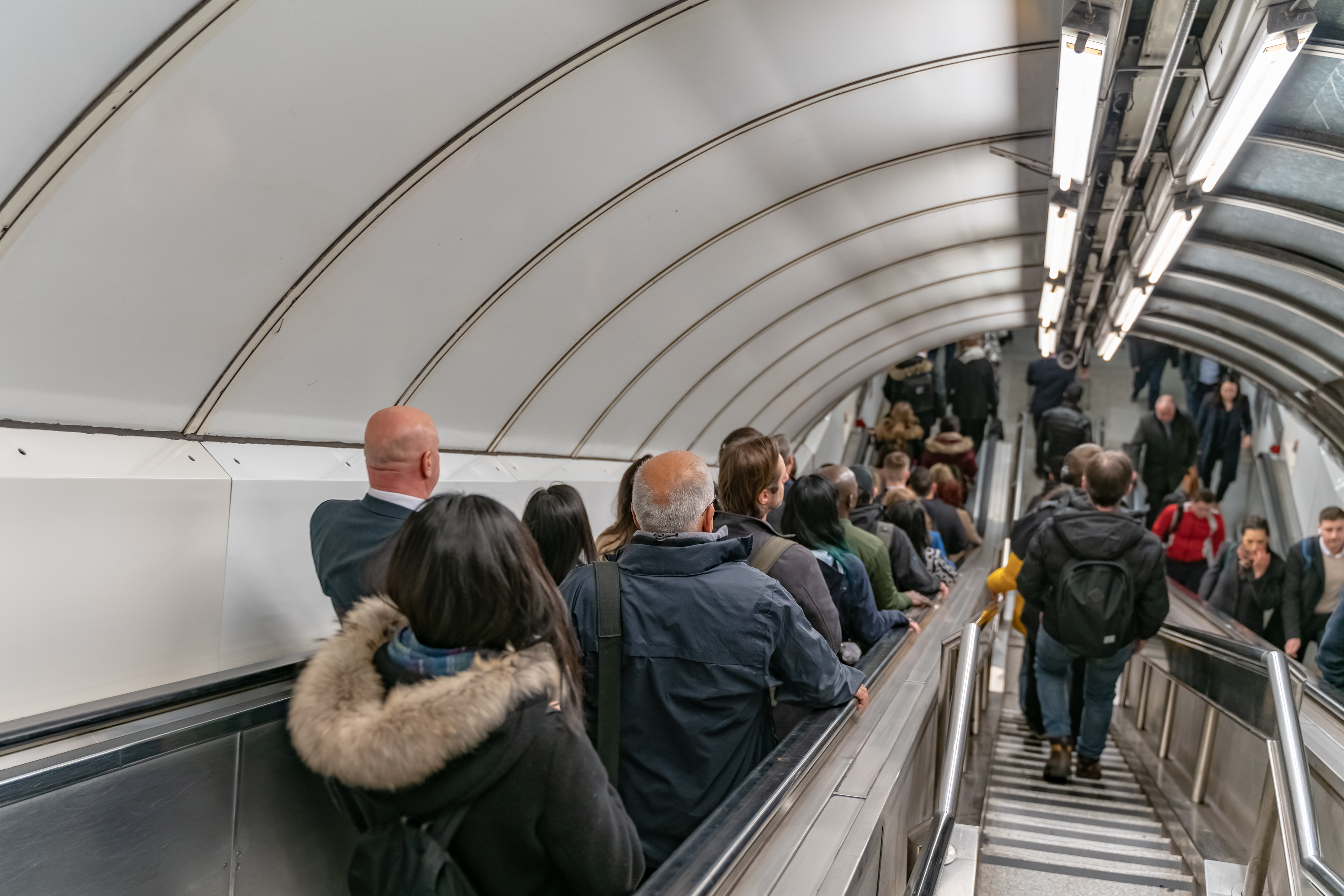 People on escalator and some on stairs