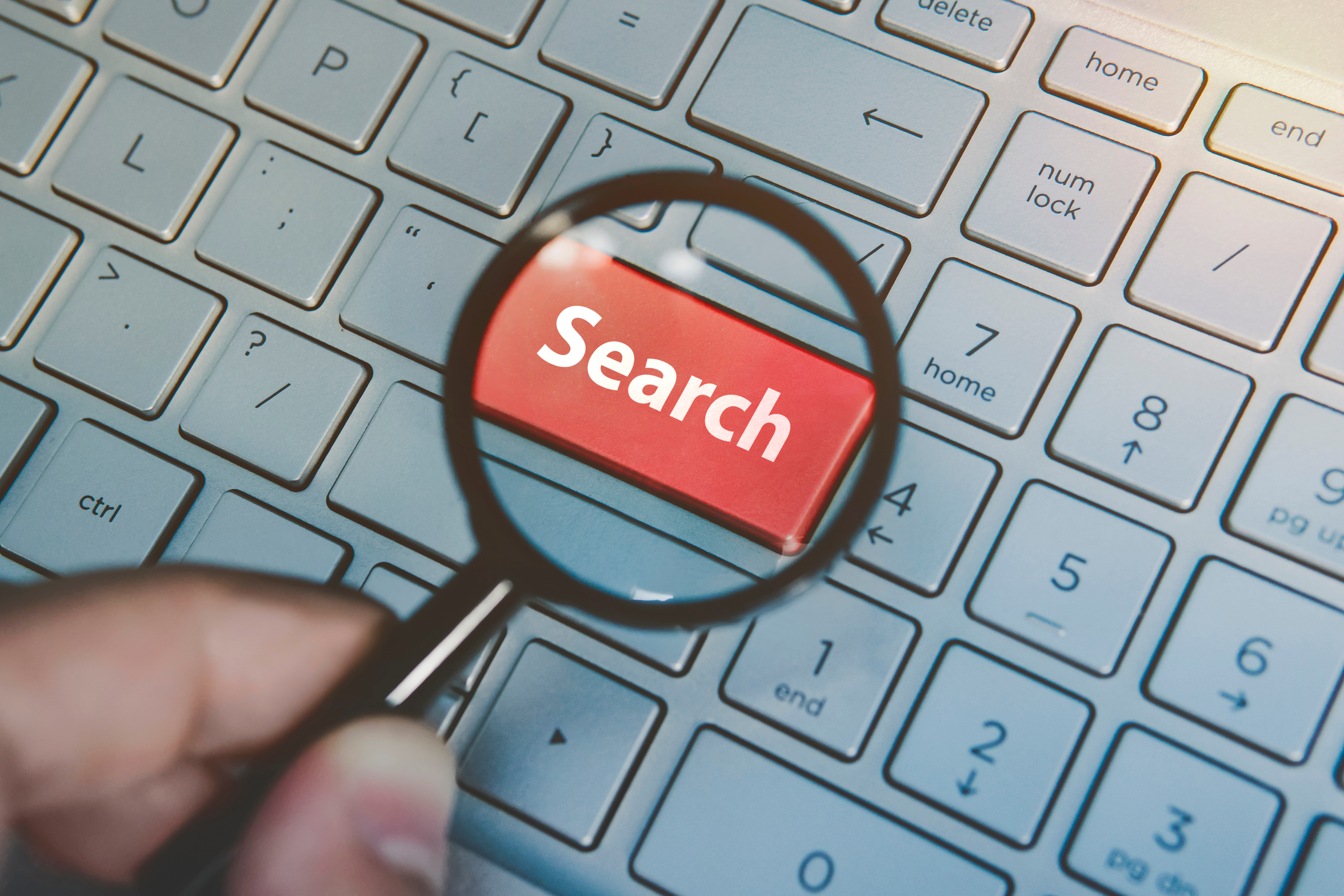 Search button highlighted on keyboard